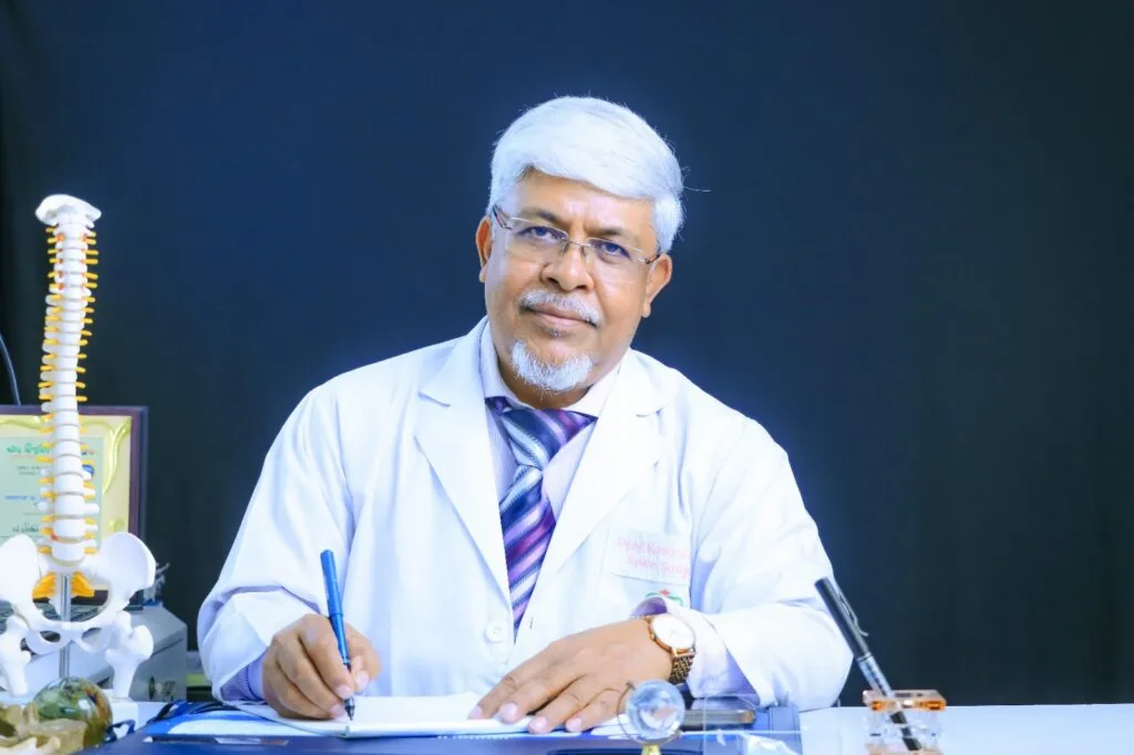 At the desk — Prof. Dr. Kamrul Ahsan, spine surgeon in Dhaka